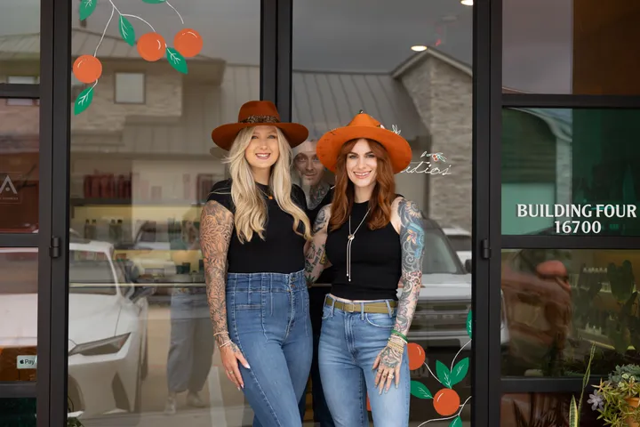 The Hart Studios co-owners at the salon entrance