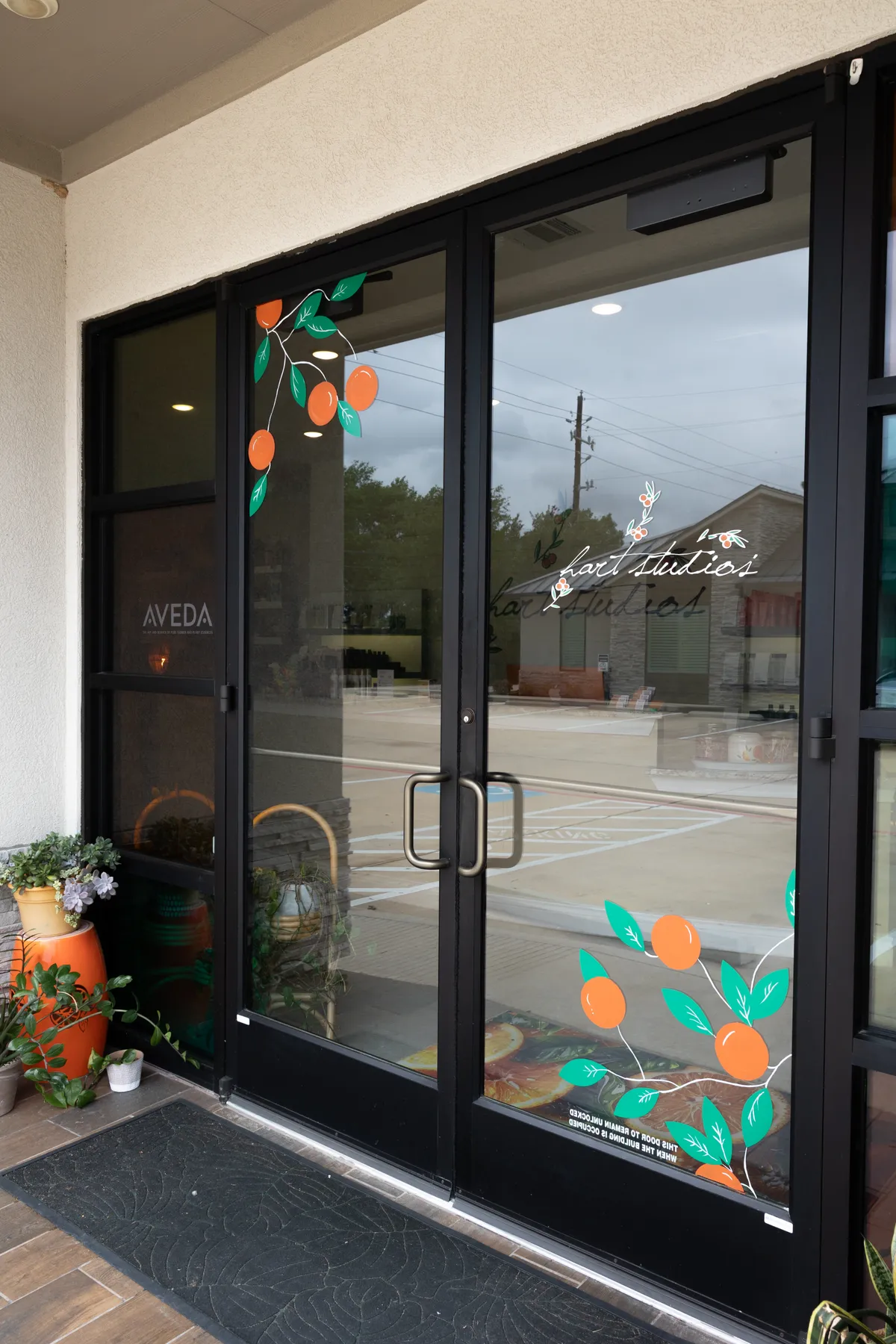 Hart’s glass entrance doors with the original script and citrus artwork